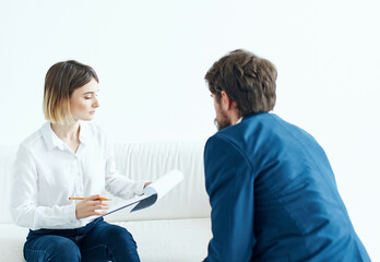 man and woman communicate work team documents