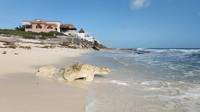 Isla Mujeres, Island. Quintana Roo. Stone turtle on the background of the Caribbean Sea. Сlear sunny day. Slow motion