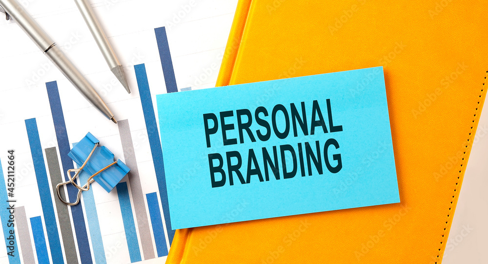 Poster personal branding text on sticker on the yellow notebook with chart and pen