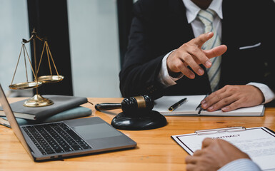 Consulting and finding a solution Concept, businesspeople consult with a lawyer or judge to find out about business fraud.