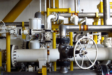 Close up of Pipeline oil and gas refinery plant form industry zone , oil and gas industrial concept. Oil or gas pipe line valves.