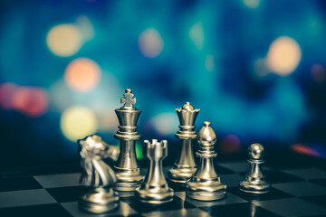 Closeup of chess characters on board games. to represent decision making in term of business strategy to find out the best solution to meet target objective and goal.