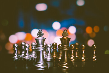 Closeup of chess characters on board games. to represent decision making in term of business strategy to find out the best solution to meet target objective and goal.