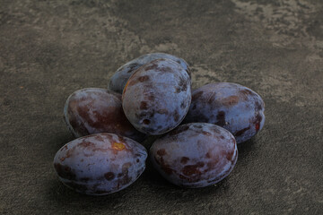 Purple sweet ripe plum heap