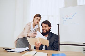 colleagues at work In the office at the desk communication discussion