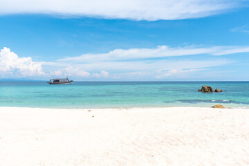 Nature in twilight period which including of sunrise over the sea and the nice beach. Summer beach with blue water and purple sky at the sunset.	
