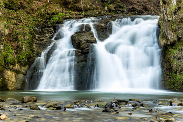 Fototapeta na wymiar Hurkalo waterfall in carpathian forest