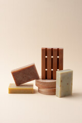 Soap on pastel beige background. Close up, copy space