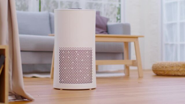 Air purifier in cozy white bedroom for filter and cleaning removing dust PM2.5 HEPA in home,for fresh air and healthy life,Air Pollution Concept
