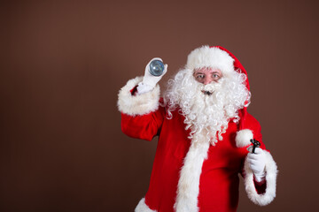 Detective Santa Claus with a flashlight.