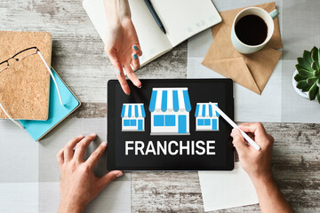 Franchise business model and growth concept on device screen.