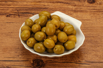 Green pickled olives in the bowl