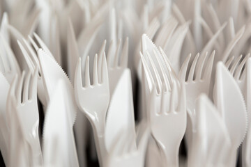 White plastic forks and knifes