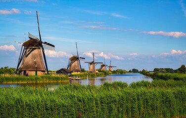 Historic windmills and a river flowing by in Kinderdijk, Netherlands