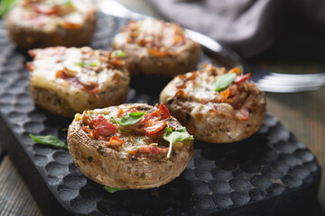 Baked mushrooms stuffed with cheese and bacon