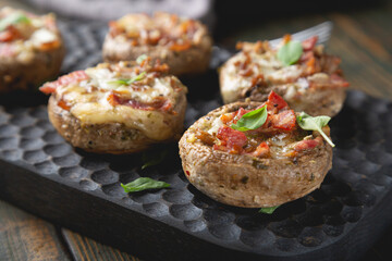 Baked mushrooms stuffed with cheese and bacon