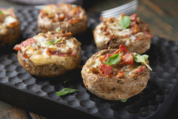 Baked mushrooms stuffed with cheese and bacon