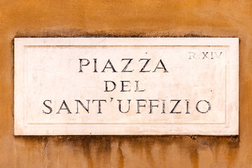 Street name piazza del sant uffizio - engl: square of the holy offices - painted at the wall in Rome