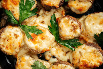 Closeup on georgian baked mushrooms with suluguni cheese