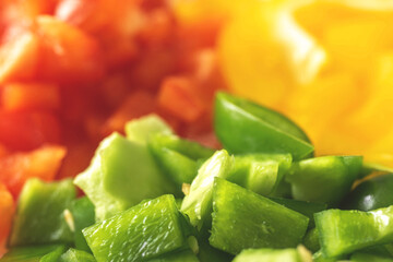 Sliced green, yellow and red sweet pepper background. Vegetable ingredient, cooking healthy food concept photo