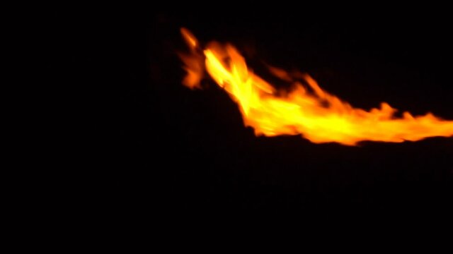 The Flamethrower stock video is an excellent piece of footage that exhibits a blazing fire from a flamethrower against a black background. 