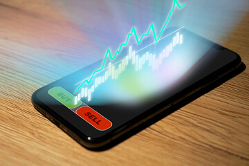 Stock Trading on a smartphone, more charts and analysis as holograph over the display, Broker,...