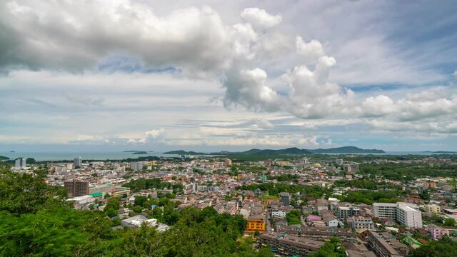 Timelapse of Khao rang hill view point to see Phuket city Thailand Amazing cityscape view point Beautiful clouds flowing in the blue sky background