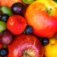 Summer fruit, berry assortment. Big apple, plum, apricot, grape and strawberry. Colorful berries in wooden crate on the table.