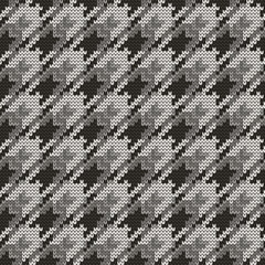 Knitted seamless goose foot black white pattern. Vector illustration.