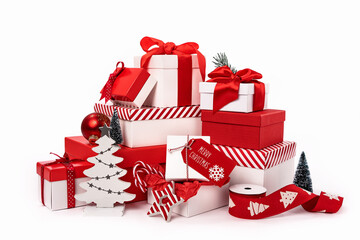 Big pile of assorted red and white gift boxes and ornaments with Christmas trees on white...