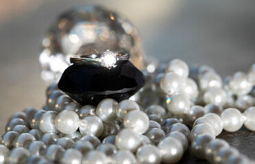 pearl necklace on black background