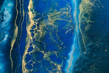 Resin art with bright colors. Blue epoxy effect background