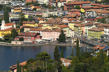 Fototapeta na wymiar Torbole, a beautiful Italian town at Lago di Garda. Top view to the old town center. Trentino, Italy.