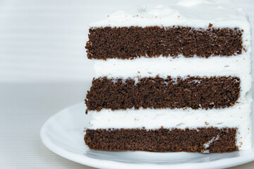 The chocolate sponge cake with butter cream is located on the right. Close-up