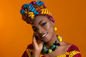 Bright jewelry with beads on the body of an African woman. Bright turban on his head.