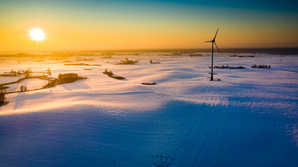 Wind turbine on field in winter. Alternative energy in Poland.