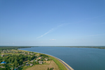 Naklejka na ściany i meble Landscape with a reservoir (Vileika reservoir) and forest spaces 