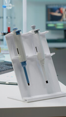 Scientific micropipette and microscope in laboratory designed for modern treatment innovation....