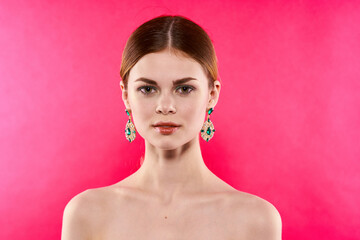 attractive woman earrings bare shoulders decoration Glamor pink background