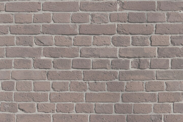 A brick wall in an old house. The texture of aged brickwork.