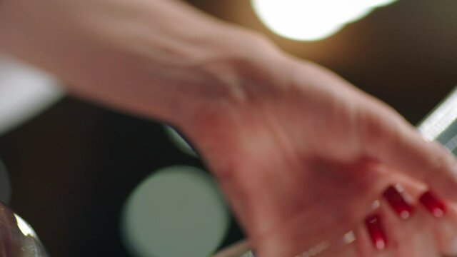 Sommelier pouring red wine from bottle into decanter . Close-up footage of wine mixing process in carafe . Preparation process to degustation of wine. Shot on RED HELIUM Cinema Camera in Slow Motion.