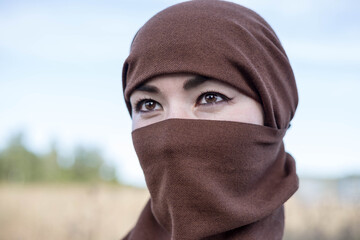 An Afghan woman in a hijab, close-up. The seizure of power. 