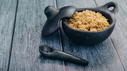 panela, from sugar cane, for different preparations on a gray background, made in Colombia.