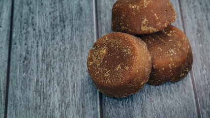 panela, from sugar cane, for different preparations on a gray background, made in Colombia.