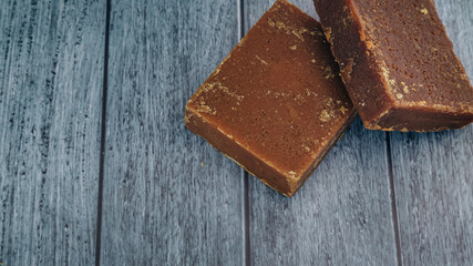 panela, from sugar cane, for different preparations on a gray background, made in Colombia.