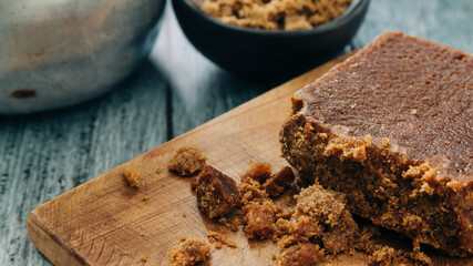 panela, from sugar cane, for different preparations on a gray background, made in Colombia.