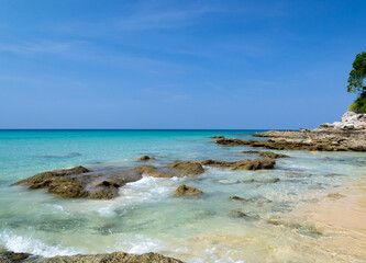 Fototapeta na wymiar sea, surin beach, beach, stones, phuket, thailand, blue sky
