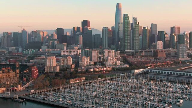 Aerial: San Francisco skyline and South Beach Harbor at sunrise, California, USA