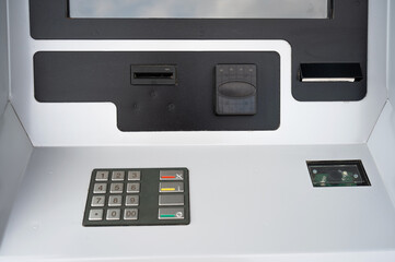 Close-up of a ticket vending machine with a blank black screen