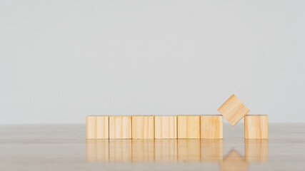 8 wooden blocks on the table. Creativity on white background. and creativity Empty wooden cube blocks that can be inserted into text.